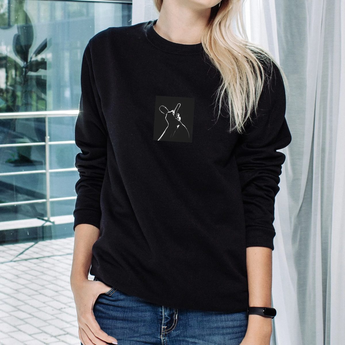 Black Skandalas sweatshirt with the microphone-and-middle-finger print